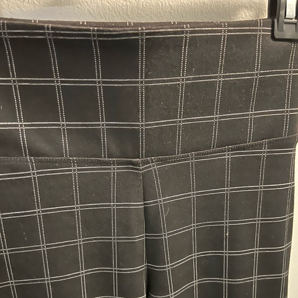 Slim fit black window pane professional style with these women's pants.